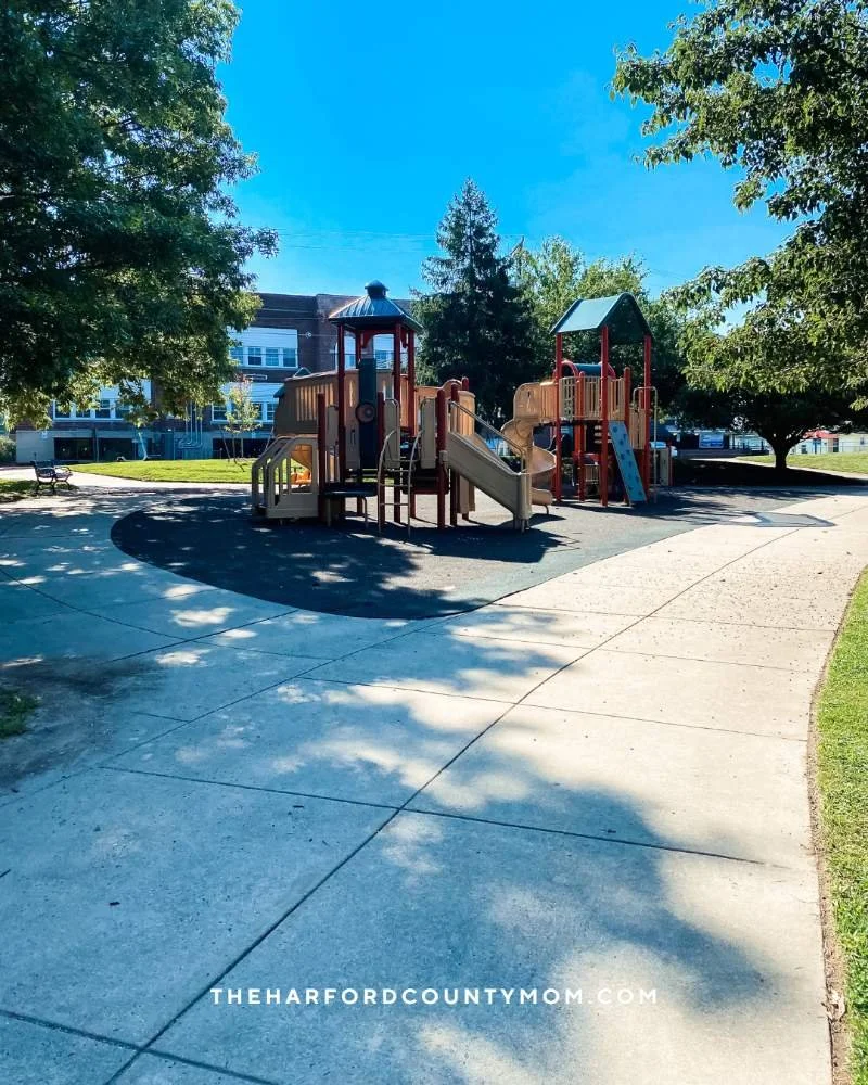 Located across from Aberdeen Library, Festival Park shows two large playground structures in partially shaded area