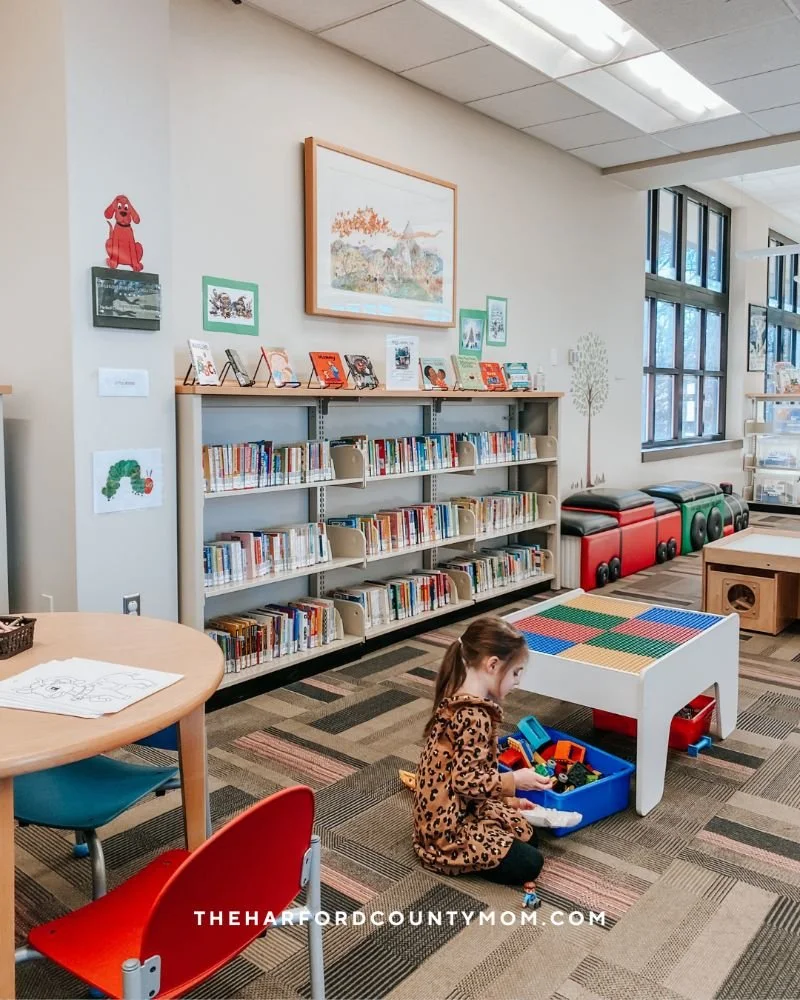 Jarrettsville Library children's section showing books, small tables for activities, toys, and games