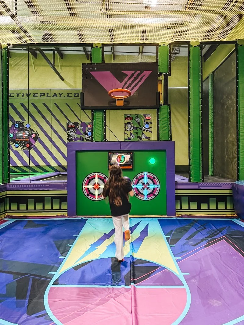 girl playing basketball on trampolines at vault activeplay