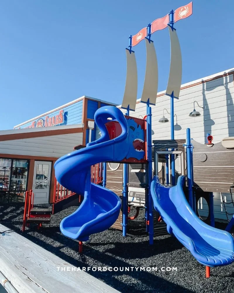 Blue slides at outdoor playground at Conrad's Seafood in Abingdon, Maryland is a great place for kids to play while parents relax and eat