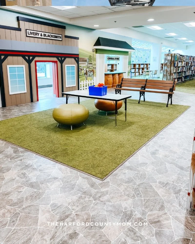 Colorful kids section at Bel Air Library shows town themed play areas for kids