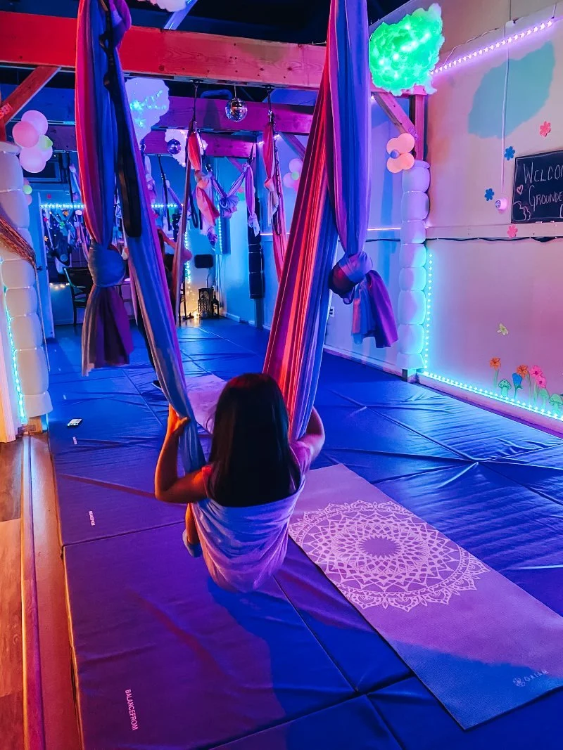 girl swinging at an aerial kids yoga studio in bel air maryland