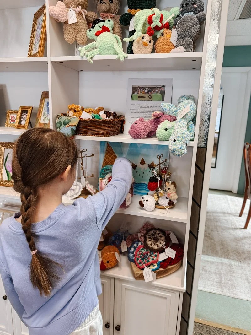 girl shopping a young maker market at richardson's flowers and gifts in bel air maryland