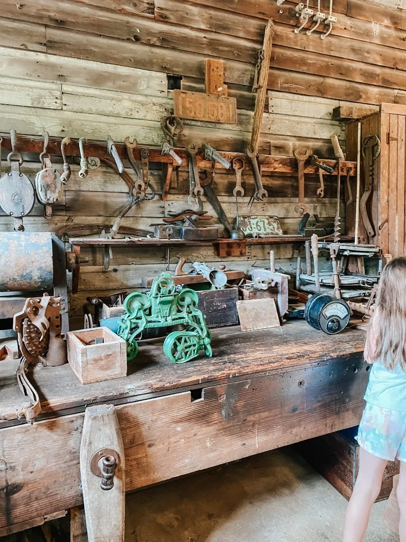 A child exploring an exhibit at the Harford County Grist Mill Museum located at the Eden Mill Nature Center in Pylesville, MD