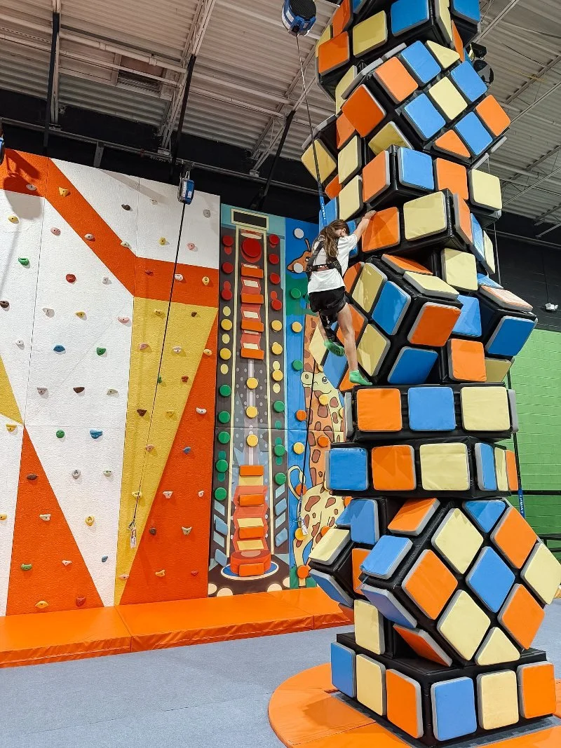 girl climbing wall at harford county trampoline park
