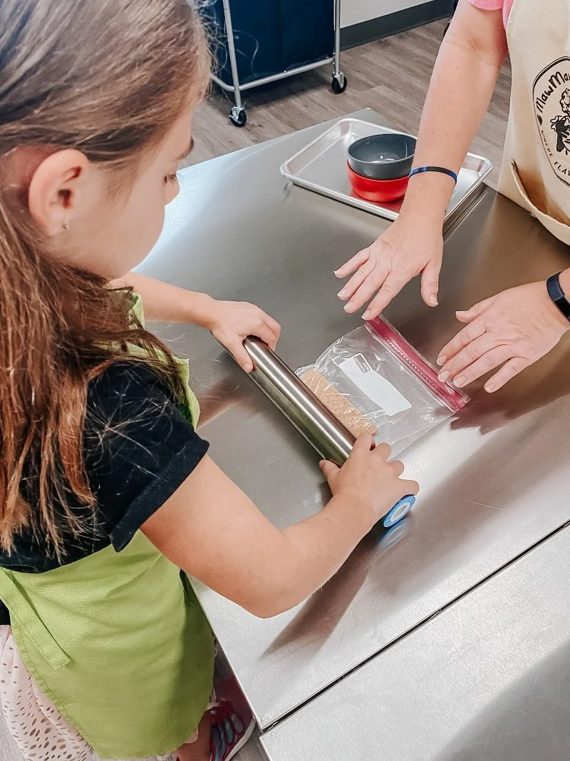 girl cooking with cindy malloy at mawmaw's creative kitchen in bel air, maryland