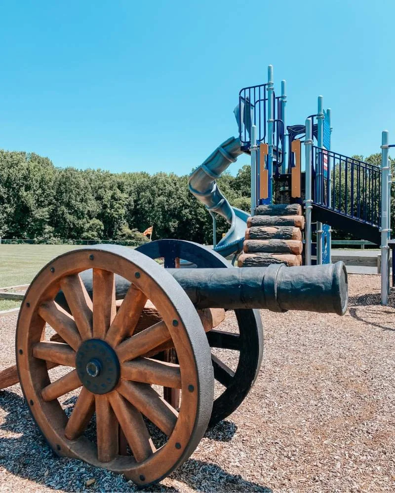 Cannon and playground structure with large open fields at Alfred B. Hilton Park in Havre de Grace, Maryland is perfect for little climbers