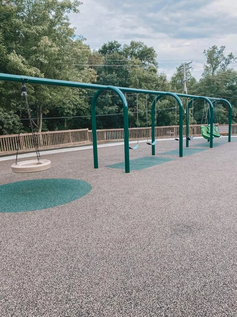 Different types of swings at Lyn Stacie Getz playground in Harford County, MD