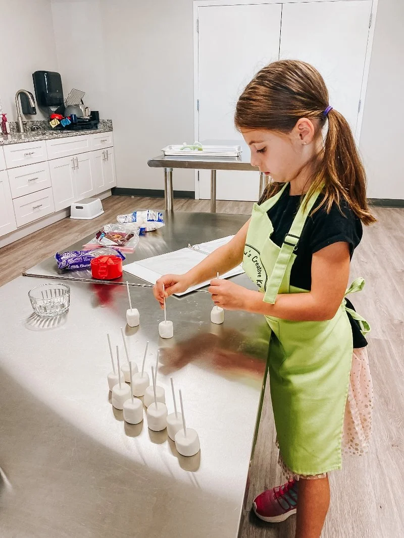 girl cooking at mawmaw's creative kitchen in bel air, maryland