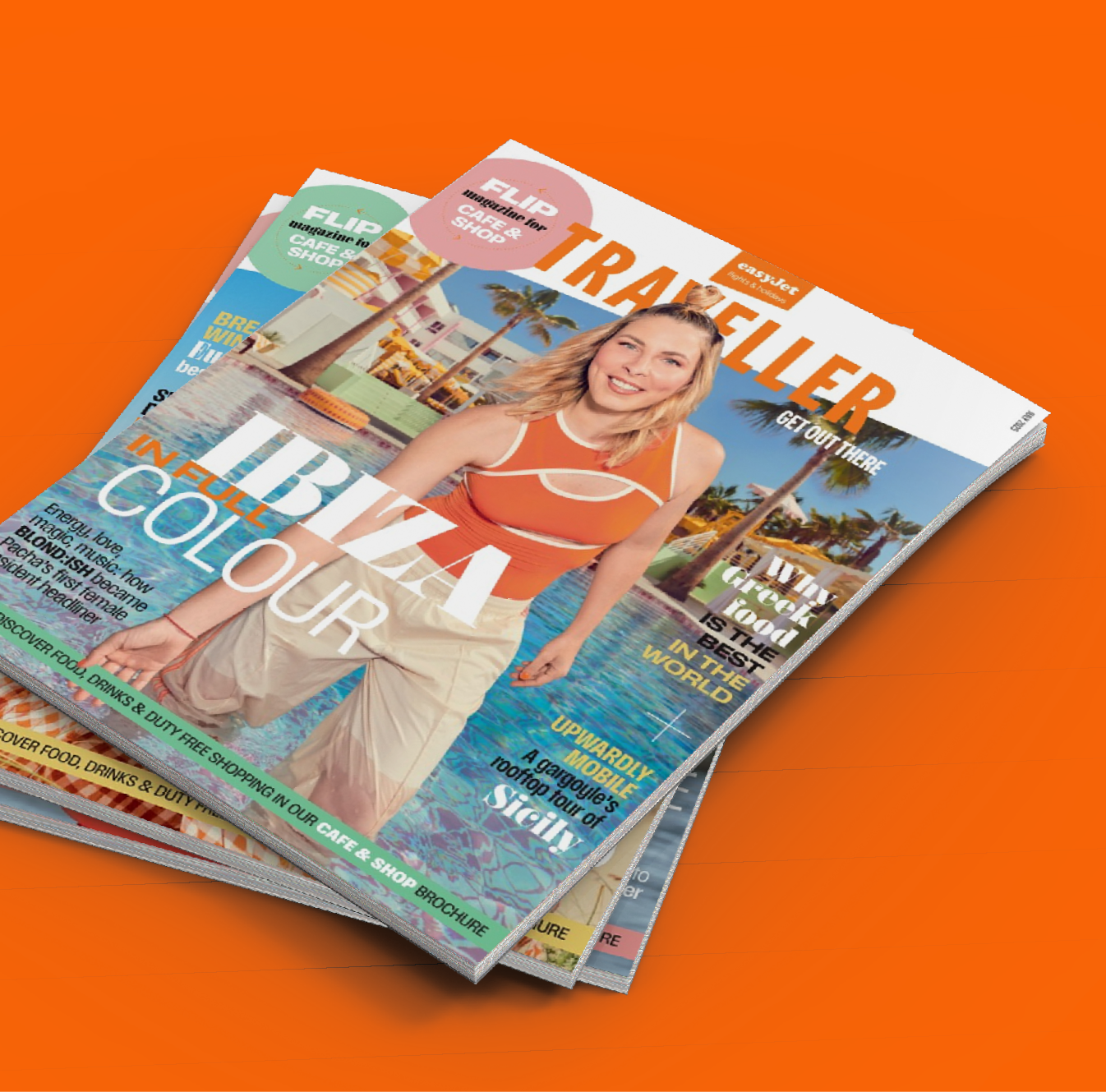 Stack of colorful travel magazines with a smiling woman in an orange top and beige pants on the cover, standing by a swimming pool with palm trees in the background.