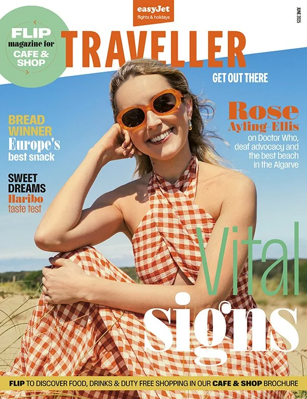 Cover of TRAVELLER magazine featuring Rose Ayling Ellis smiling in a checkered dress and sunglasses at the beach, with headlines about travel, food, and beach destinations.
