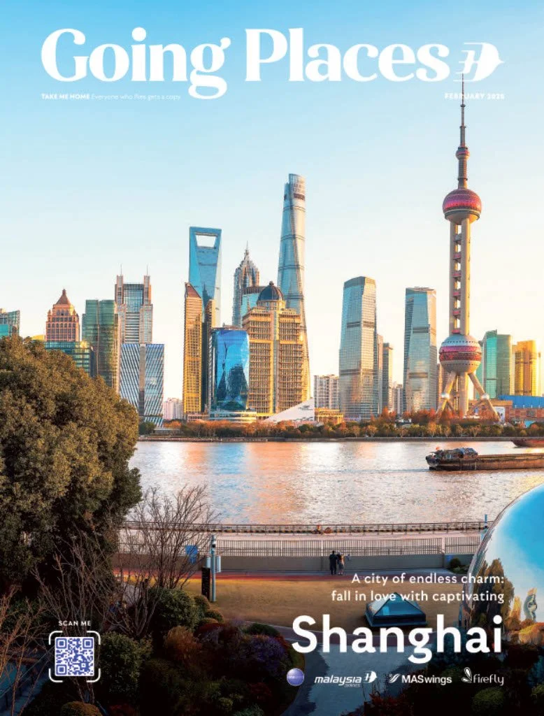 Skyline of Shanghai with the Oriental Pearl Tower, Shanghai Tower, and other skyscrapers along the river, viewed during sunset.