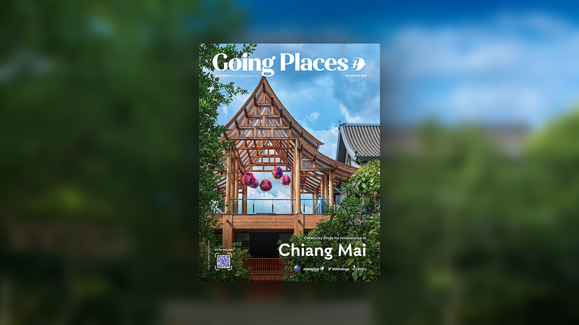 Magazine cover titled "Going Places" with a photograph of a traditional Thai wooden pavilion with hanging colorful lanterns, green trees, and a blue sky with clouds, focusing on Chiang Mai.