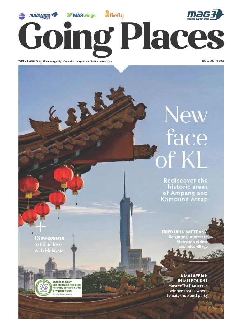 Cover of a magazine titled 'Going Places' featuring a cityscape of Kuala Lumpur, Malaysia with the iconic Petronas Towers in the background and traditional Chinese temple roof decorations in the foreground, September 2023 issue.