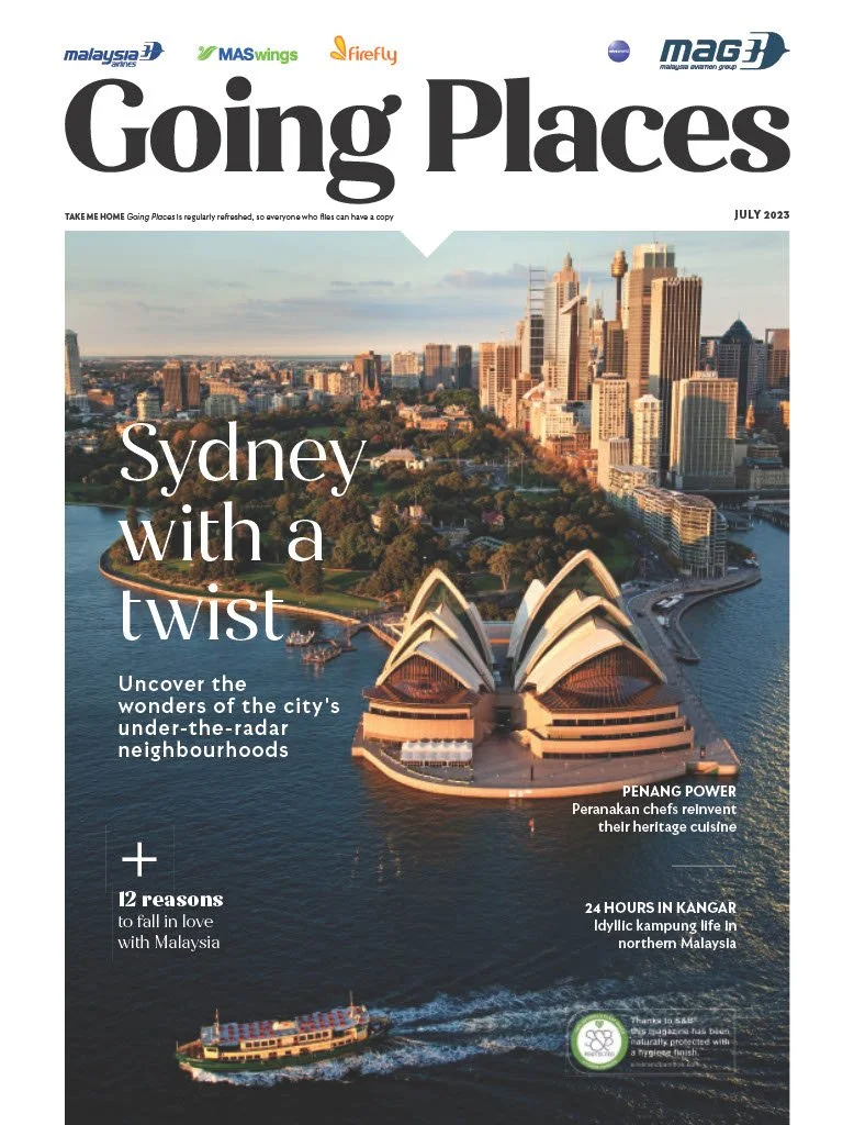 Cover of a travel magazine titled 'Going Places' featuring a photo of the Sydney Opera House and the city skyline of Sydney, Australia, with a ferry on the water and various headlines about travel experiences and attractions.