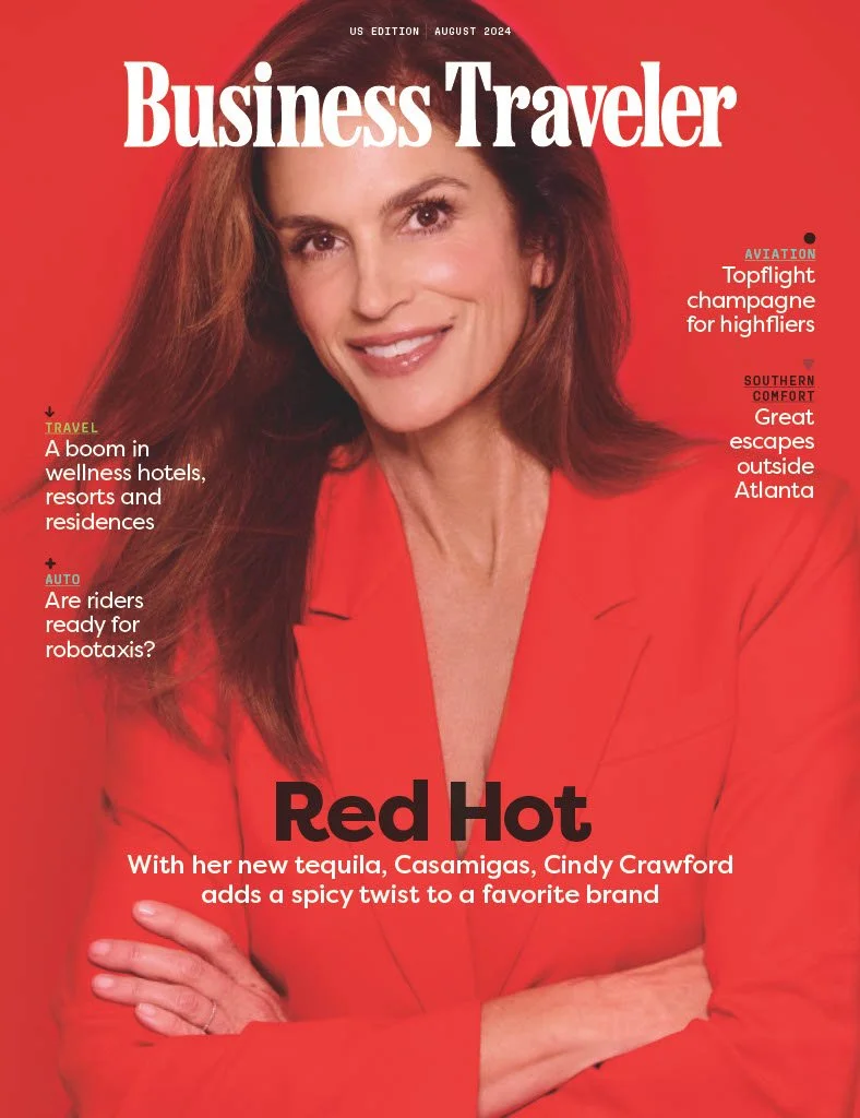Cover of Business Traveler magazine, August 2024 issue, featuring Cindy Crawford in a red blazer with her arms crossed, smiling. Headlines include topics on tequila, travel, and aviation.