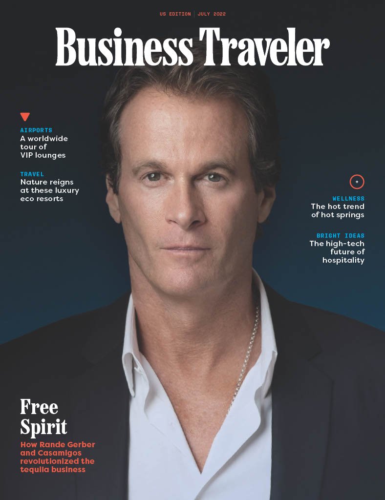 The cover of Business Traveler magazine, July 2022 issue, featuring a man with light skin, brown hair, dressed in a black blazer and white shirt, against a dark background.