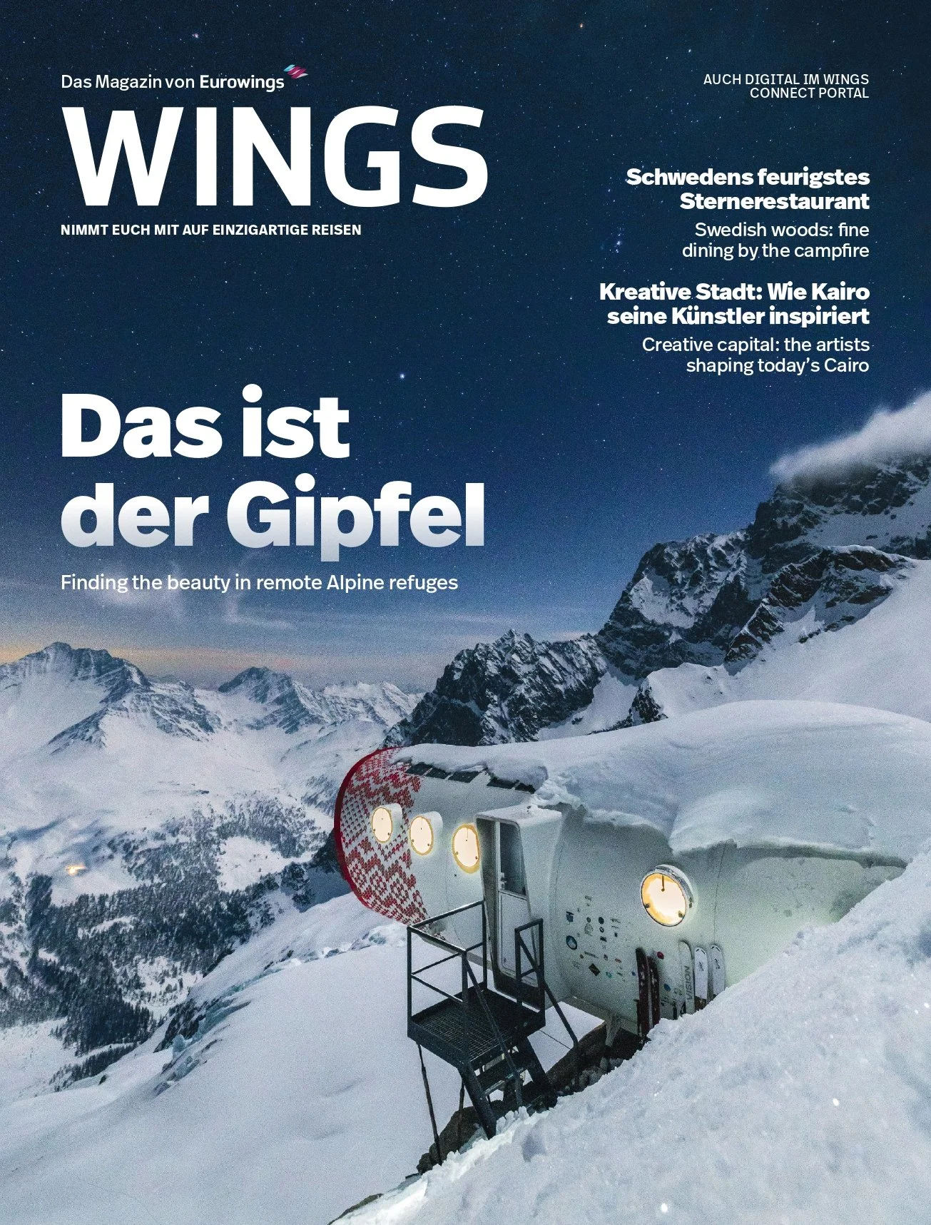 Magazine cover titled 'WINGS' featuring a snowy mountain landscape with a mountain rescue helicopter partially buried in snow, under a starry night sky.