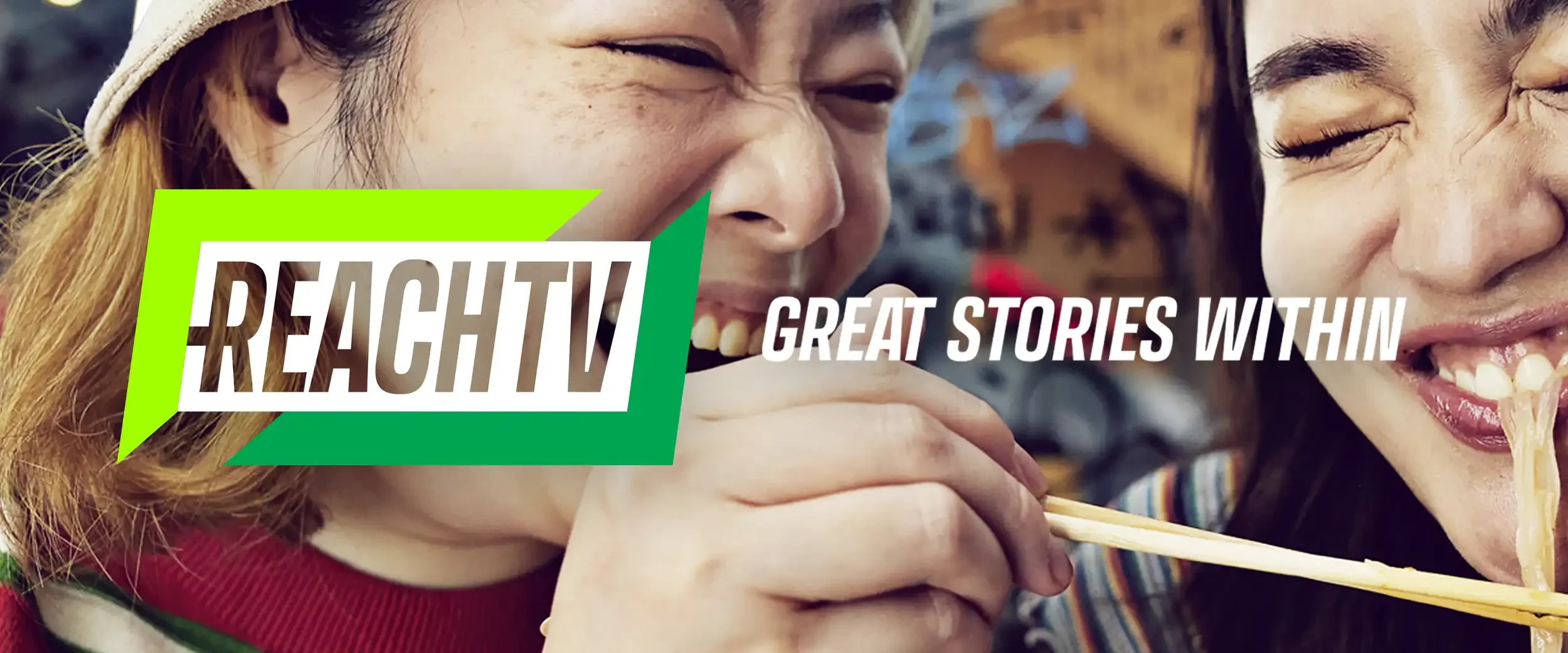 ReachTV logo and tagline overlaying two women enjoying a meal, smiling and laughing while eating noodles with chopsticks.