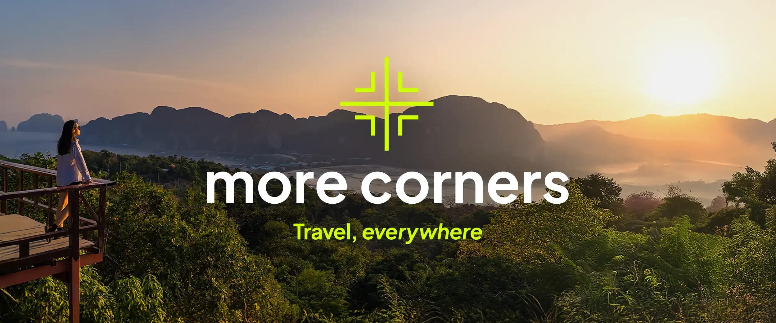 A woman standing on a wooden balcony overlooking a lush green valley and mountains during sunset, with the text 'more corners' and 'Travel, everywhere' overlaid.