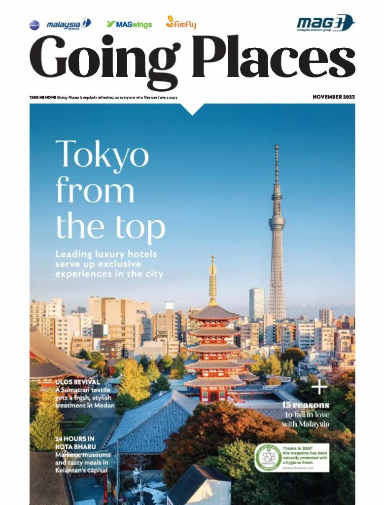 Cover page of a travel magazine titled 'Going Places' with a view of Tokyo, Japan, showing traditional Japanese architecture in the foreground and modern skyscrapers including Tokyo Skytree in the background, with headlines about luxury hotels and travel experiences.