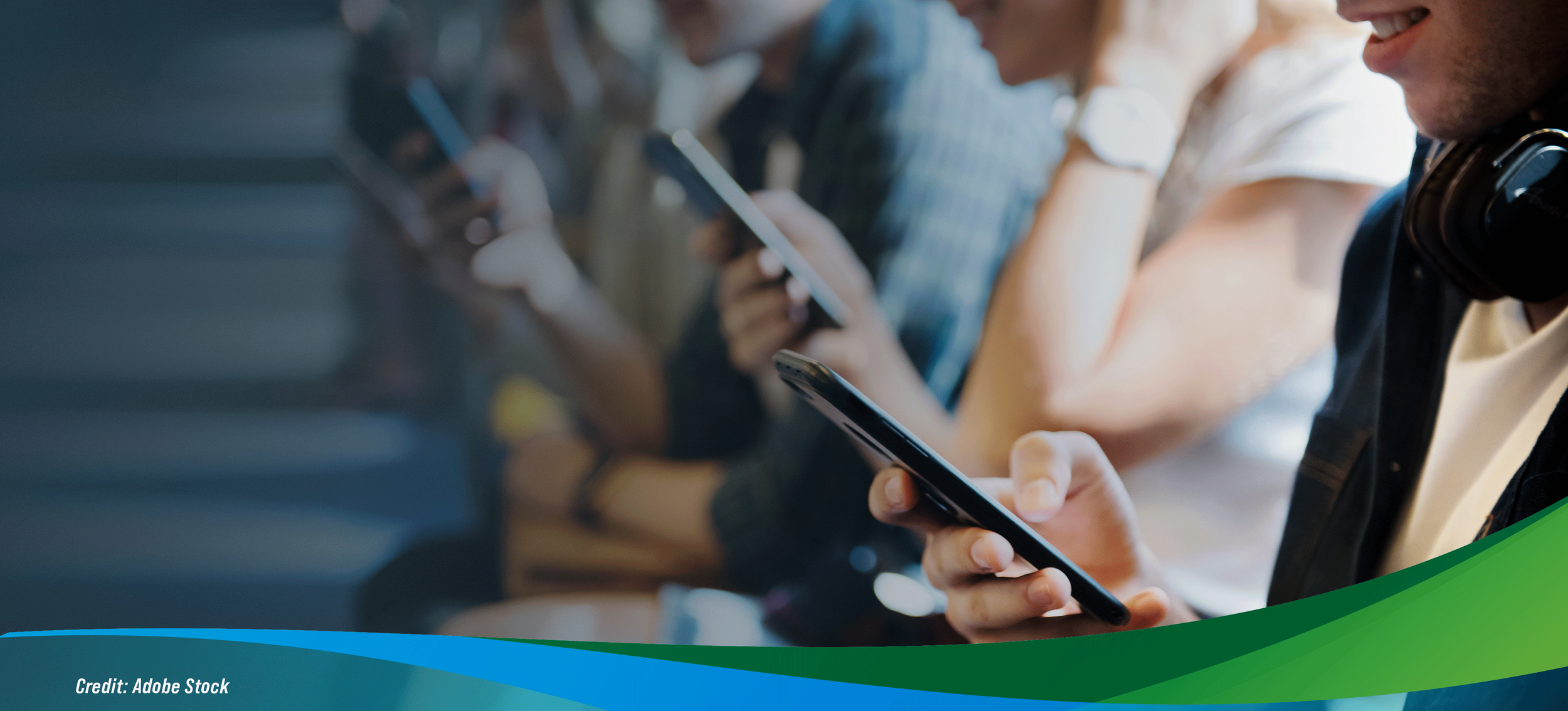 A group of people looking at cell phones