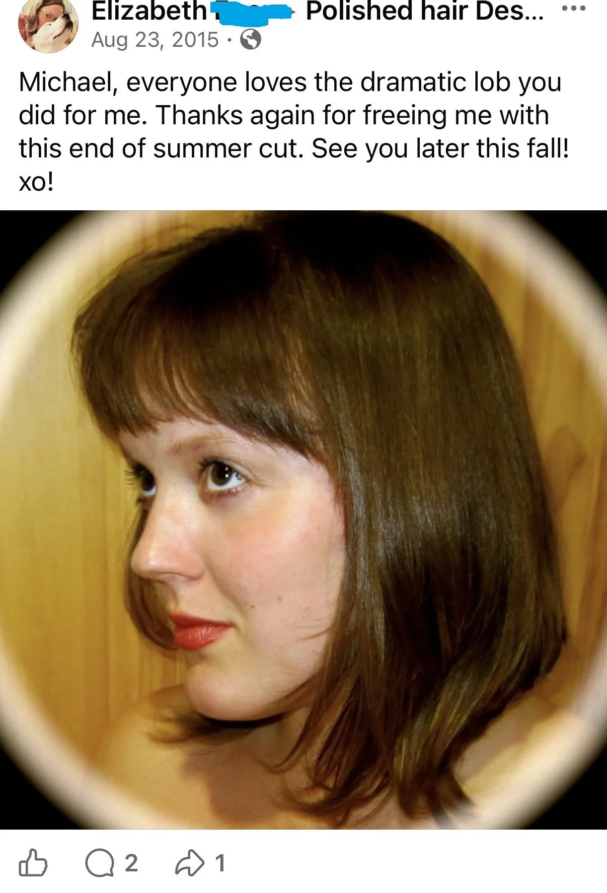 A woman with medium-length brown hair and light skin, looking to the side, with a wooden background.