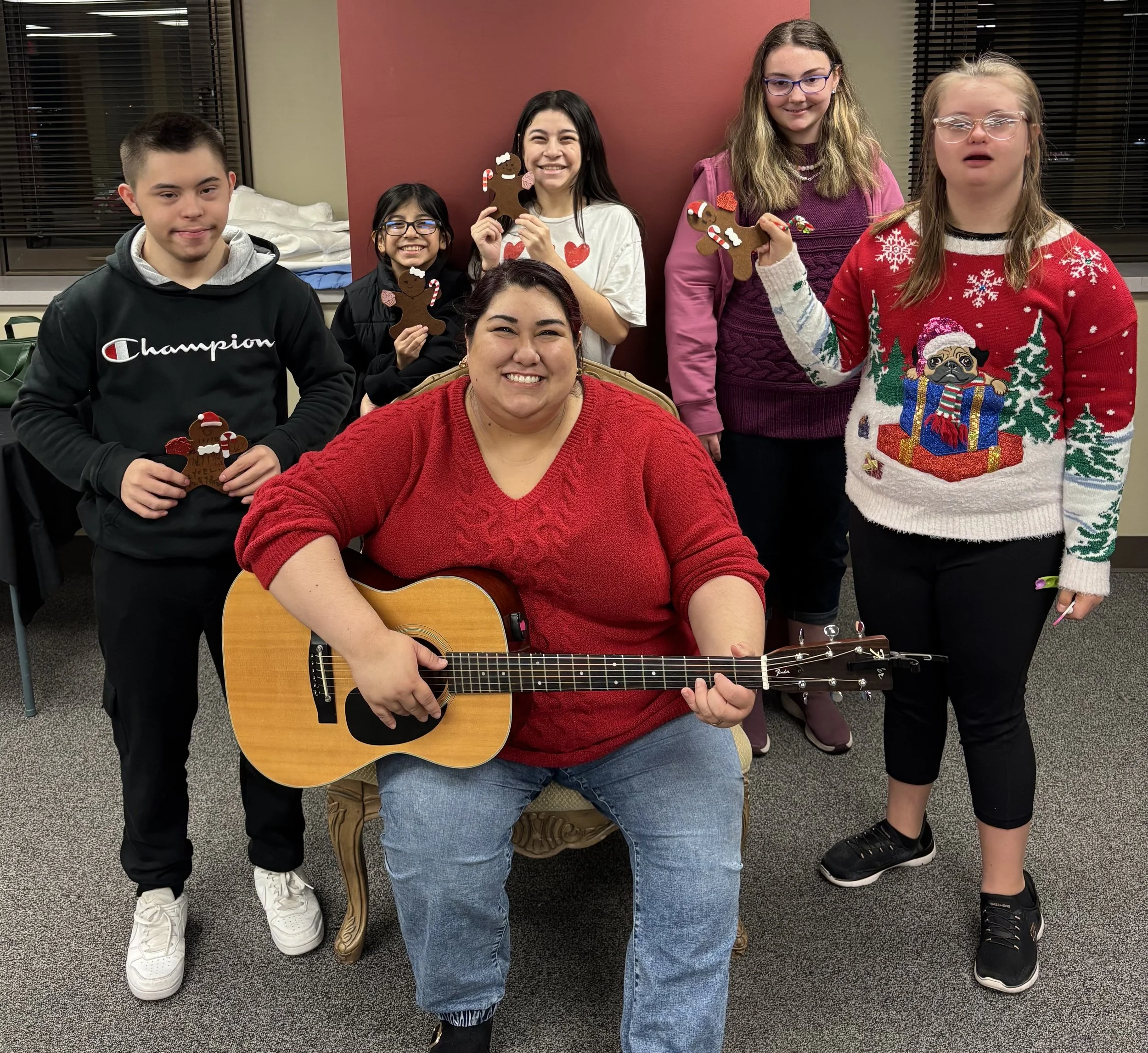  Samantha Noissaman, center, with Grace Notes music therapy, hosts Amelia’s Friends Foundation members for a recent gathering. (Photo provided) 
