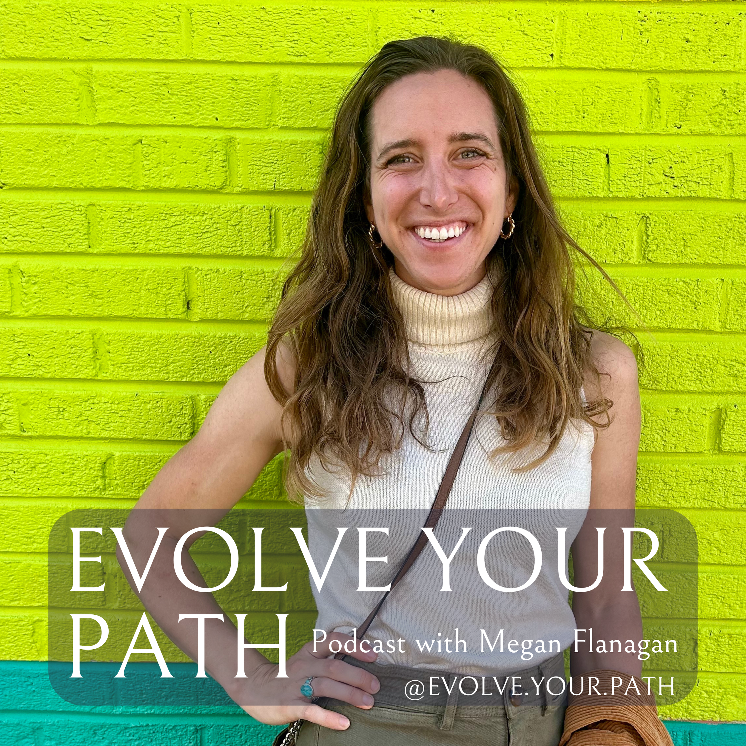 A smiling woman with long wavy brown hair wearing a beige sleeveless turtleneck top, hoop earrings, and a brown wristband, standing in front of a bright yellow brick wall. There is a turquoise section visible at the bottom of the image. Text overlay says, "Evolve Your Path, Podcast with Megan Flanagan, @EVOLVE.YOUR.PATH."