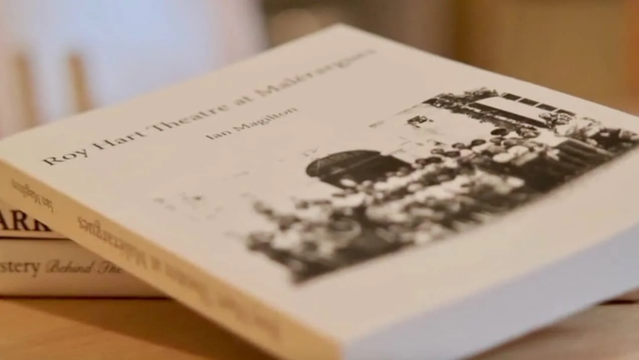 A book titled 'Boy Hart Theatre at Malérargues' by Ian Magilton, with a black-and-white photograph of members of the Roy Hart Theatre in front of the chateau on the cover.