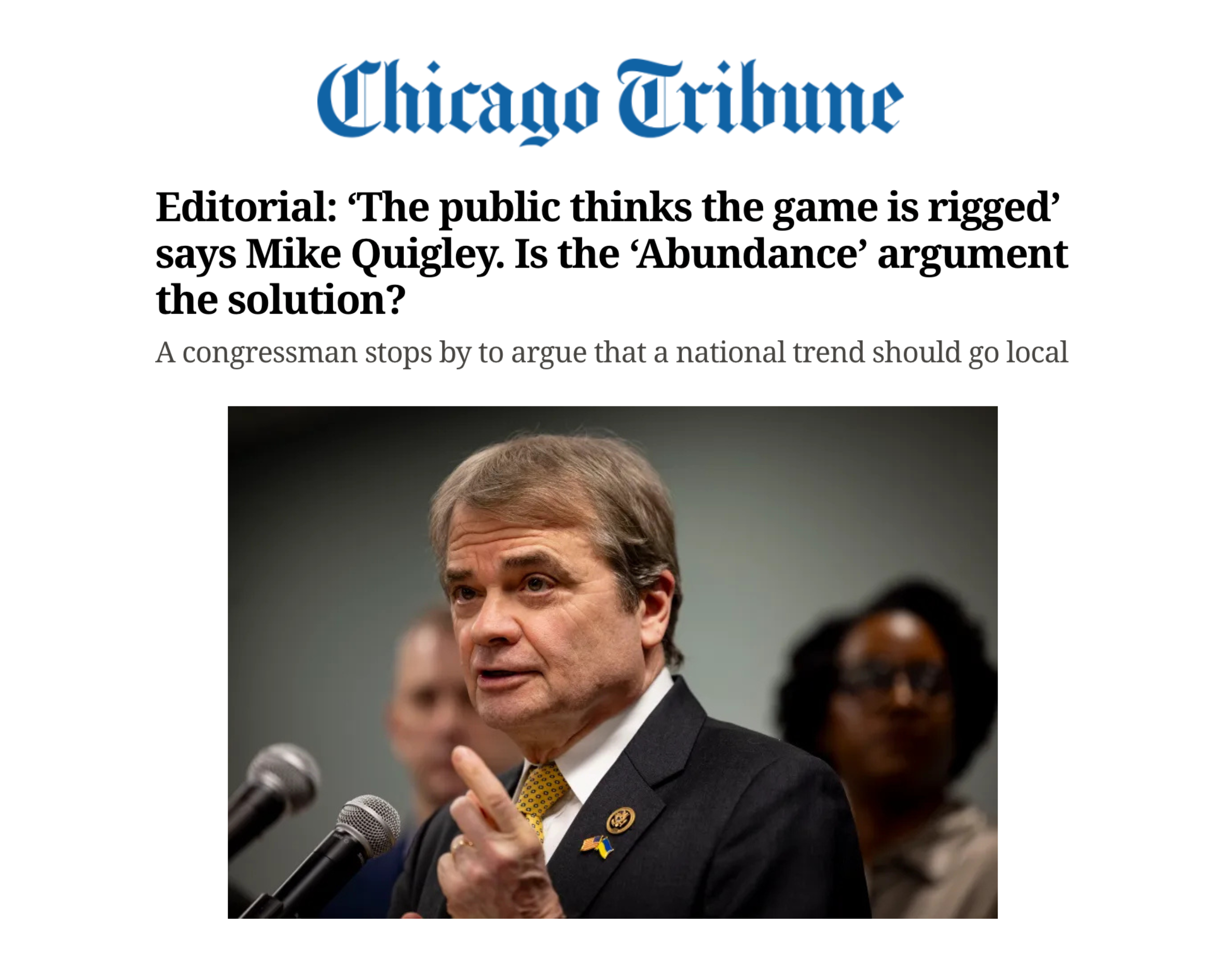 Screenshot of a Chicago Tribune article with a headline about sports and politics, featuring a photo of a man in a suit speaking at a microphone, with a woman in background.