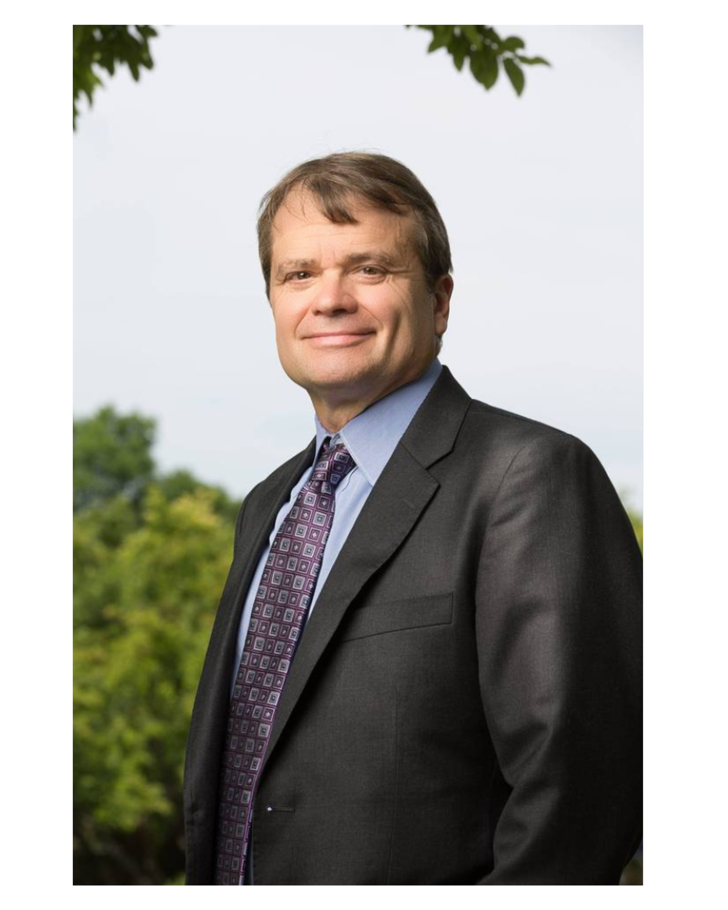 Illinois Congressman Mike Quigley, outdoors in a dark suit.