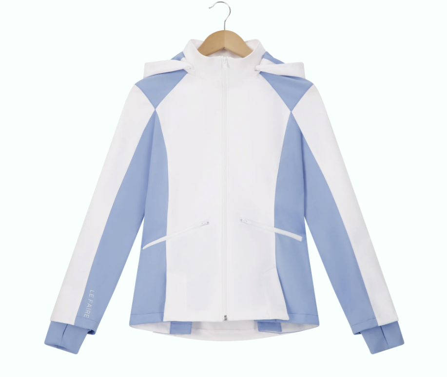 White and light blue athletic zip-up jacket with a hood, hanging on a wooden hanger.