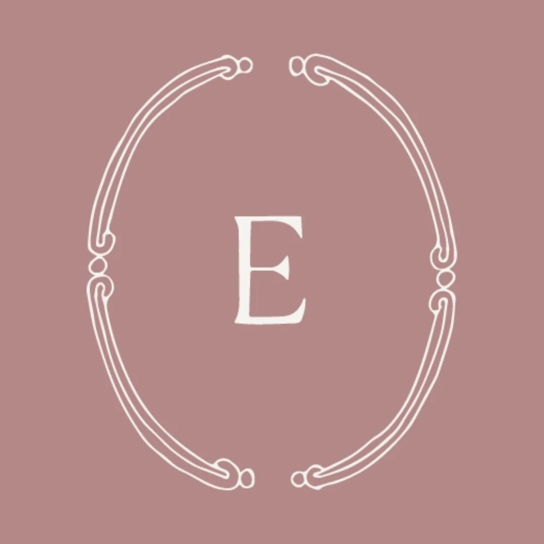 A decorative letter 'E' inside a white ornate oval frame on a muted pink background.
