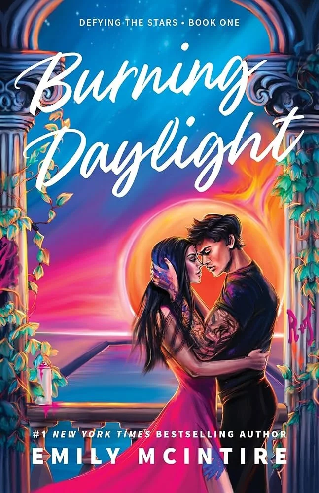 Book cover for 'Burning Daylight' by Emily McIntire, showing a romantic scene with a man and woman embracing in front of a sunset, surrounded by columns with floral decorations.