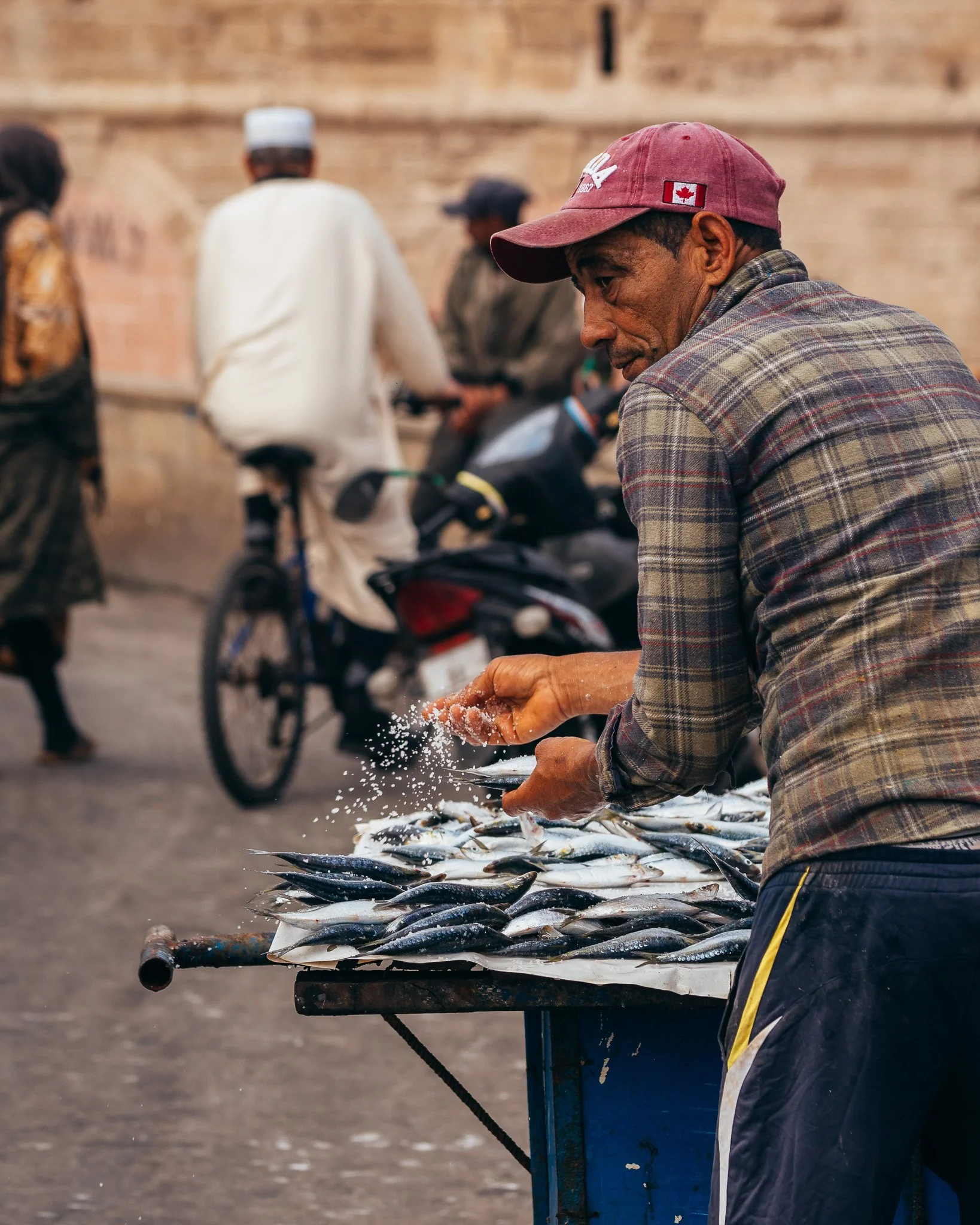 Moroccan Fisherman salting fish