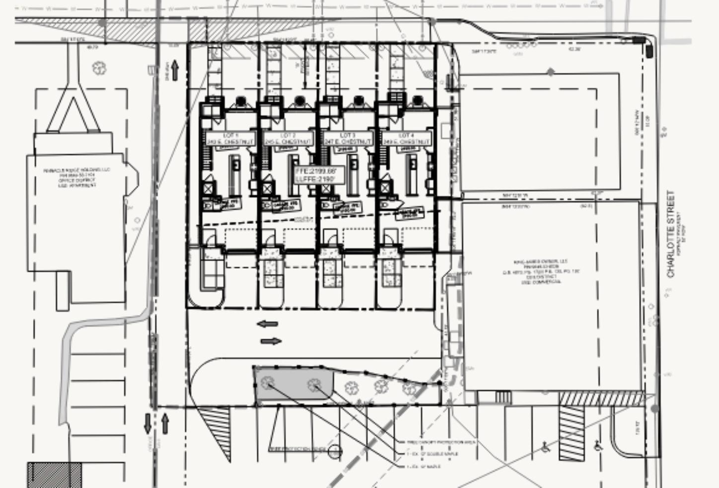Architectural site plan showing layout of multiple townhouses, parking spaces, pathways, and surrounding streets.