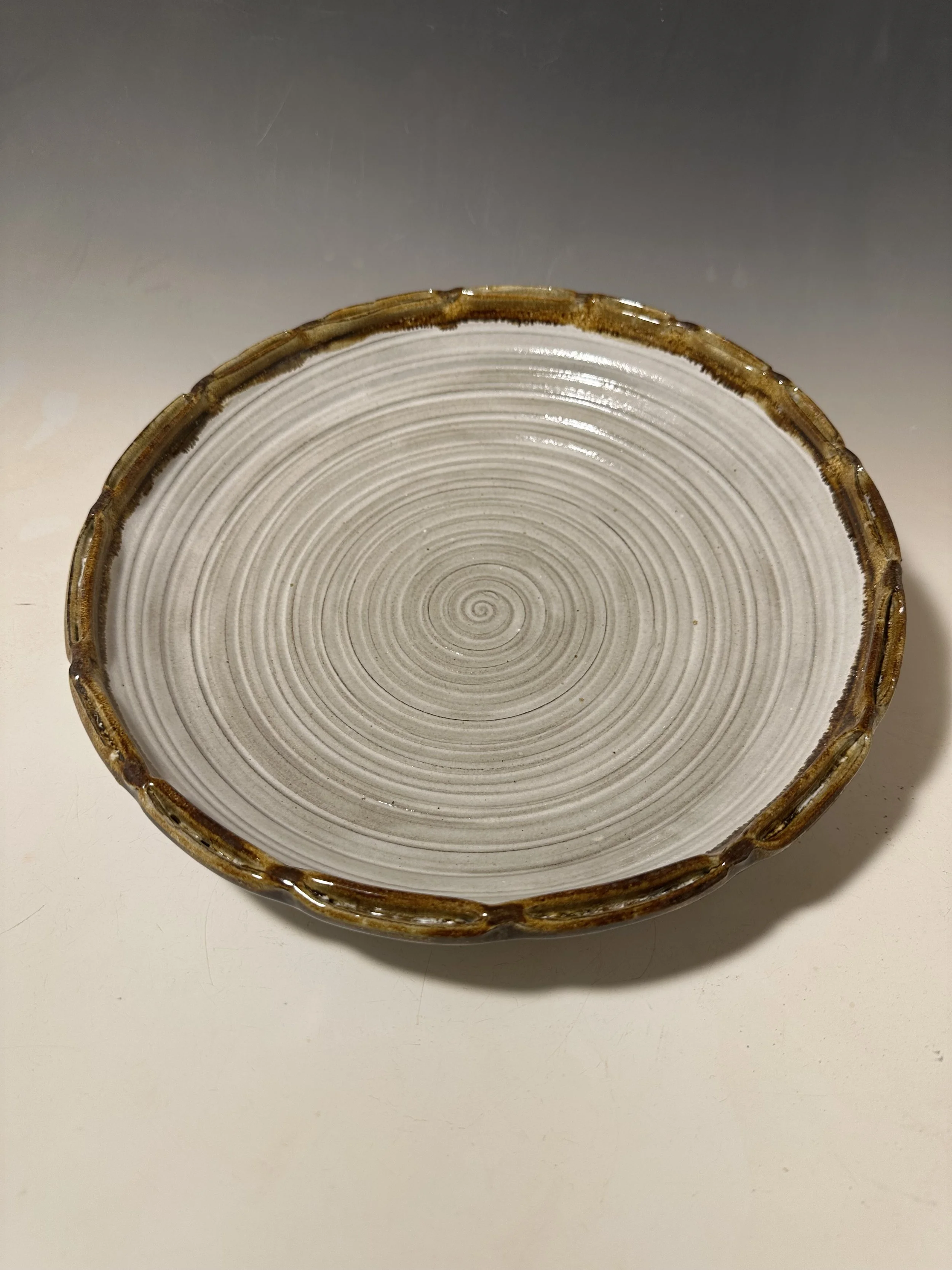 I don't make many plates.  This one has a pinched double rim which I just love!