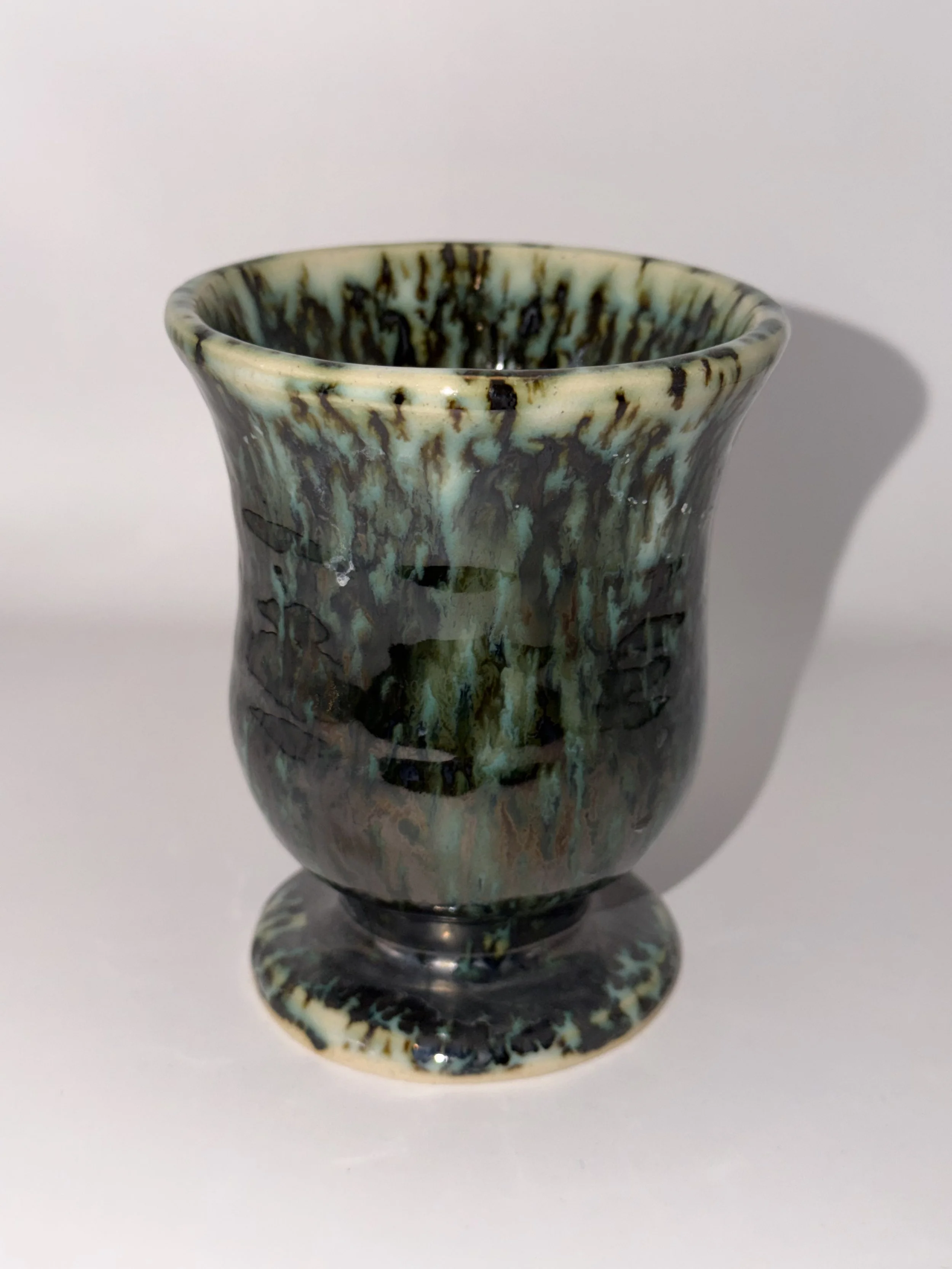 Small vase, more goblet shaped.  Love the metallic drips.  About 6 inches high.