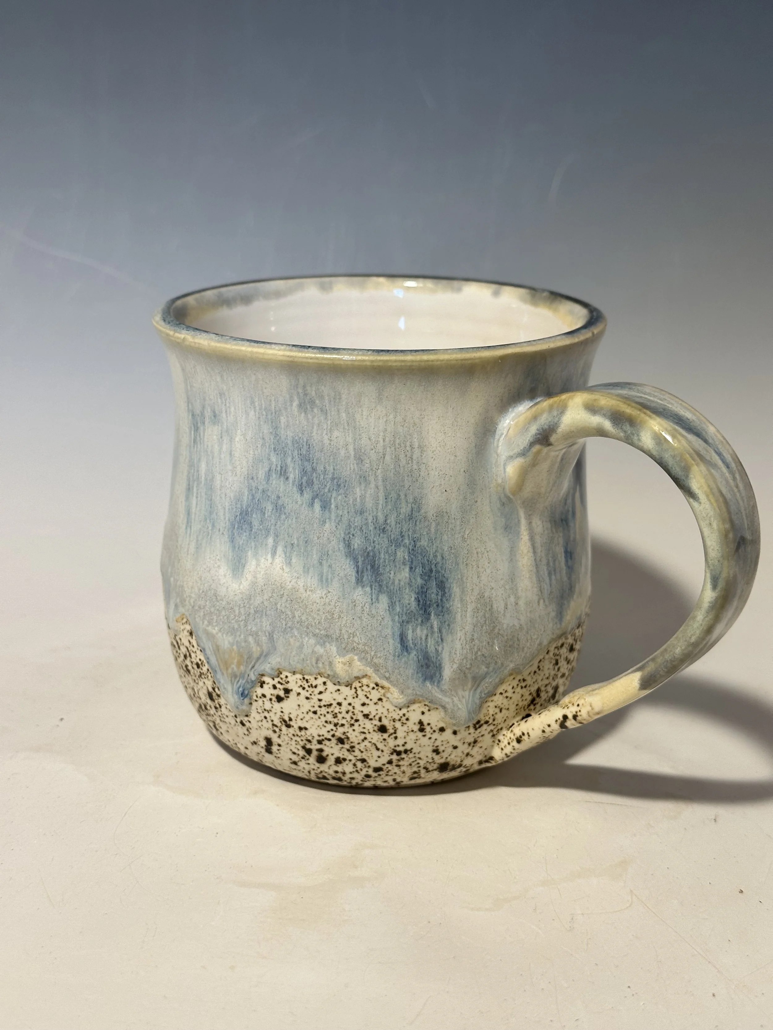 Sandy bottom with blue and cream - very cloud-like and calming.