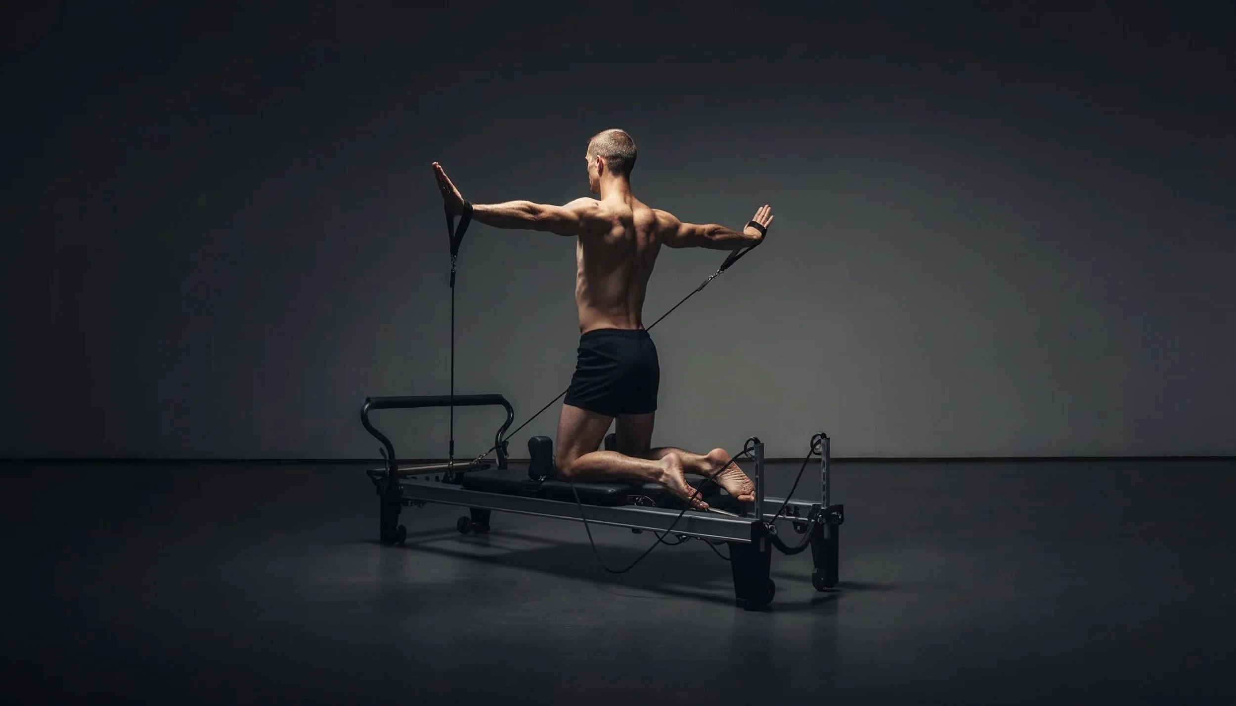 A man is practicing Pilates