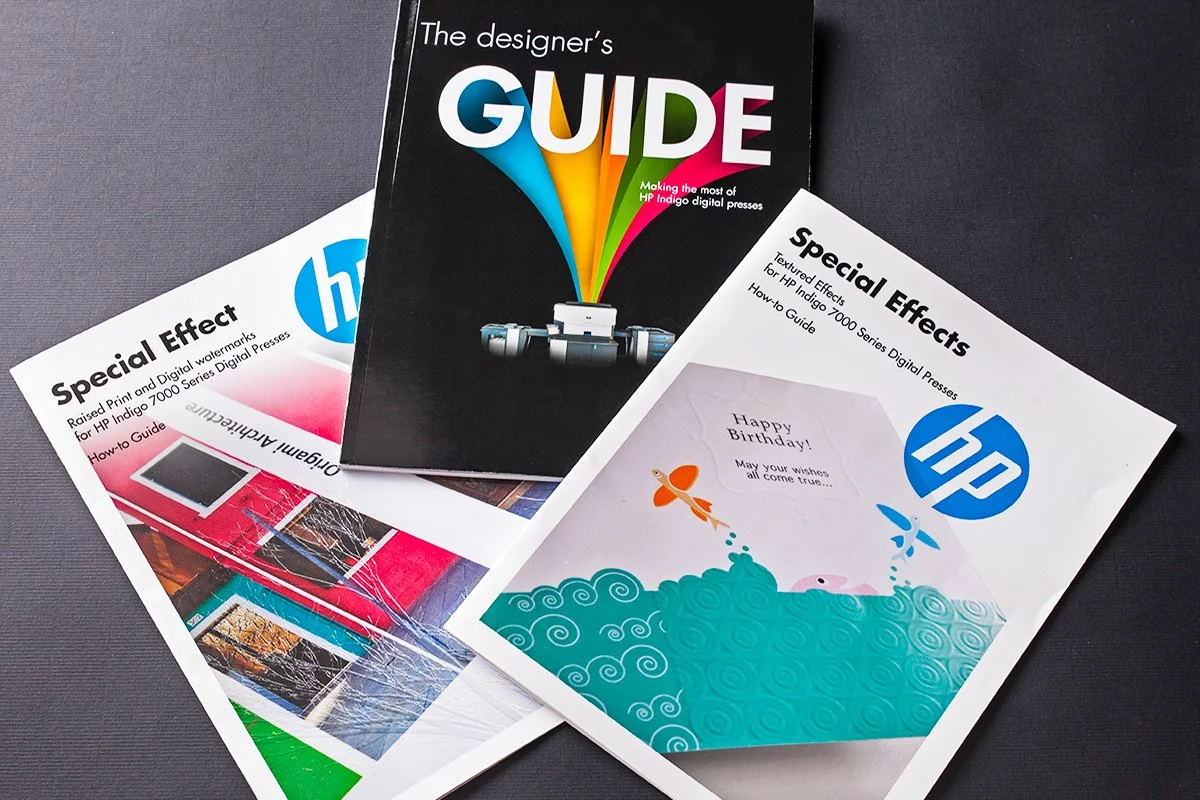 Three HP guides about special effects and digital print for HP Indigo 7000 series, with one guide titled 'The designer's GUIDE' featuring colorful Art paper and the other two guides titled 'Special Effects' with one showing a birthday card design.