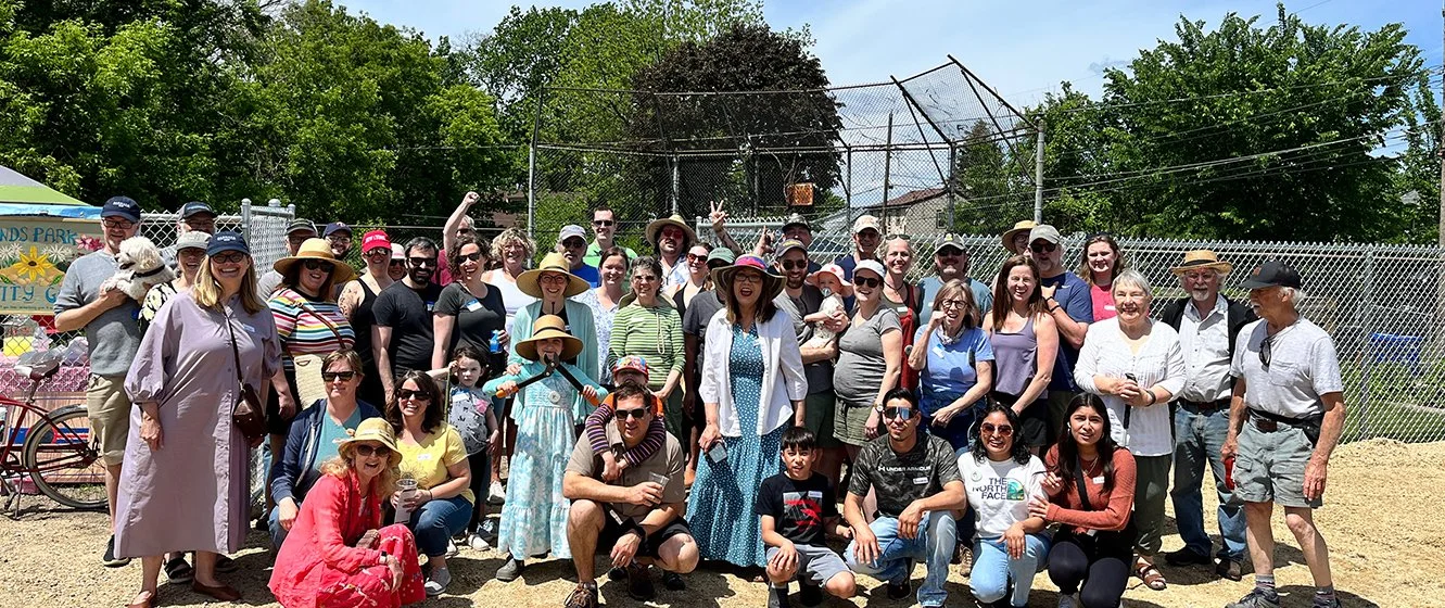Group photo at the ribbon cutting of the Mounds Park Community Garden, May 2024