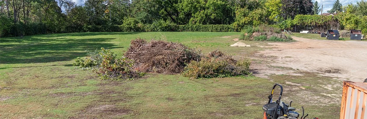 Wide shot of Mounds Park, with dirt piles and rubbish.