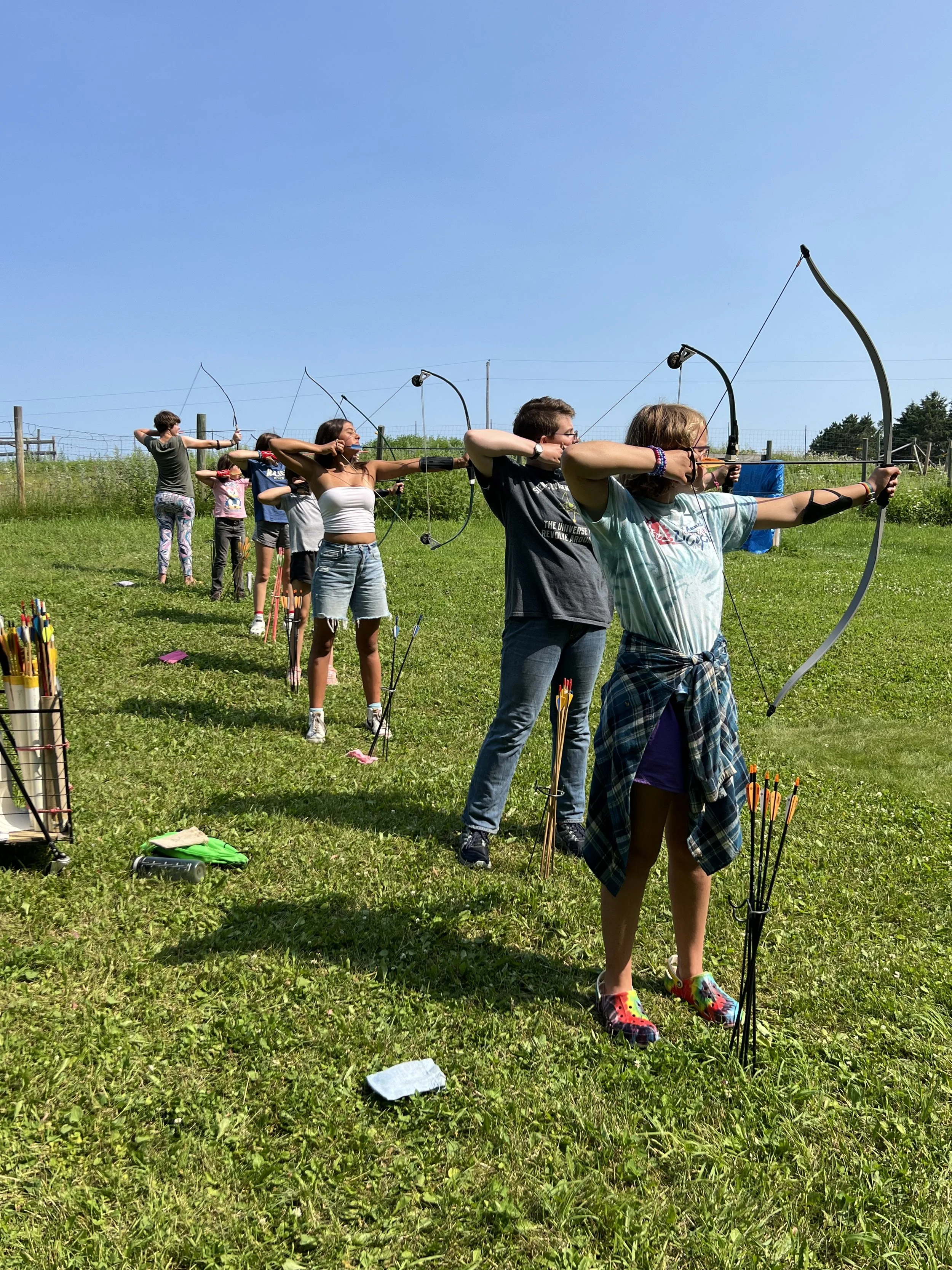 Archery shooting line with advanced shooters in front