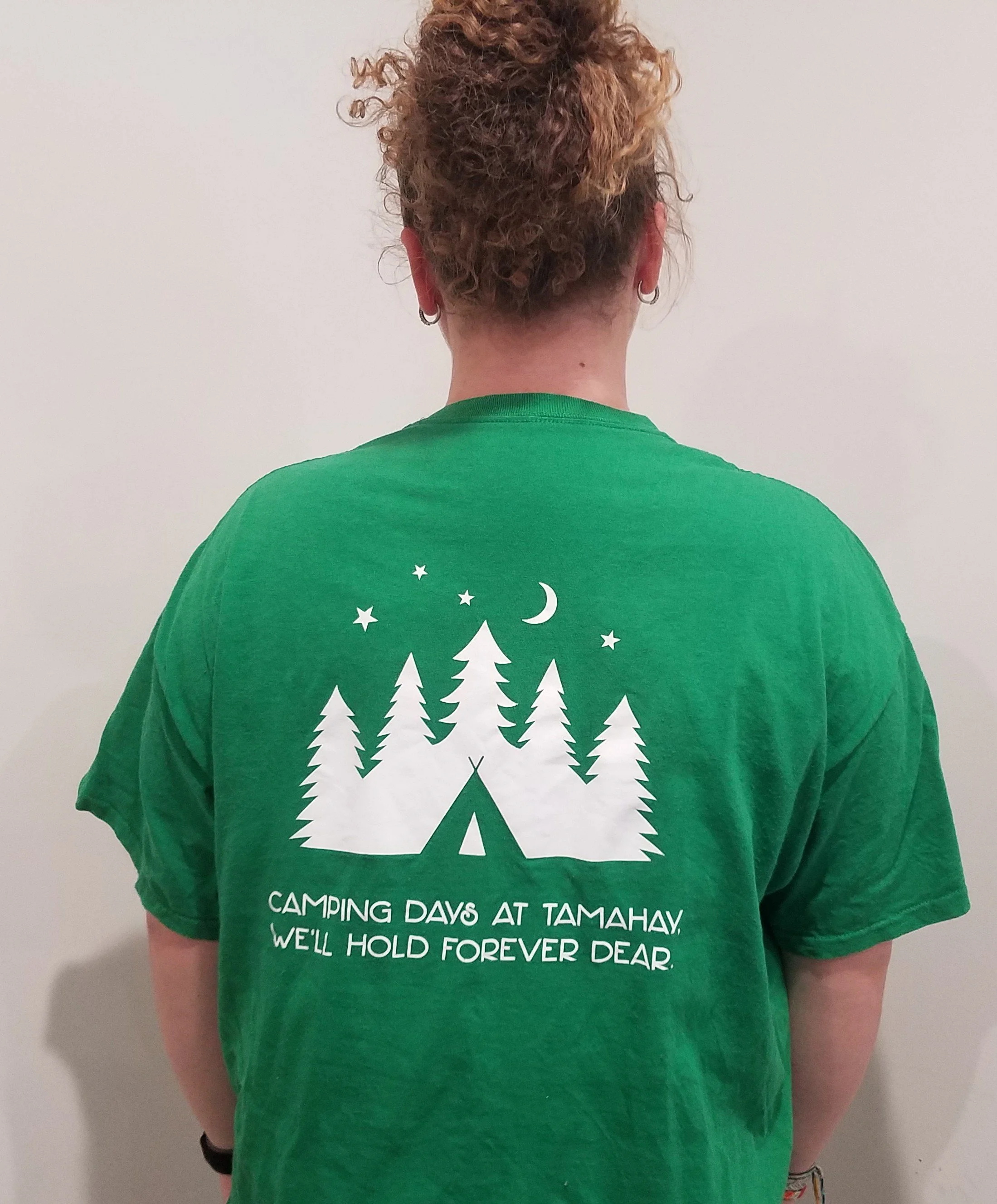 Girl showing back of green shirt