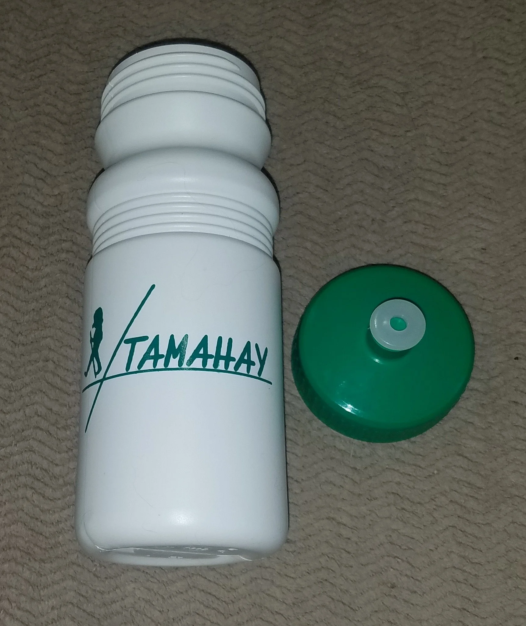 White water bottle with green lettering