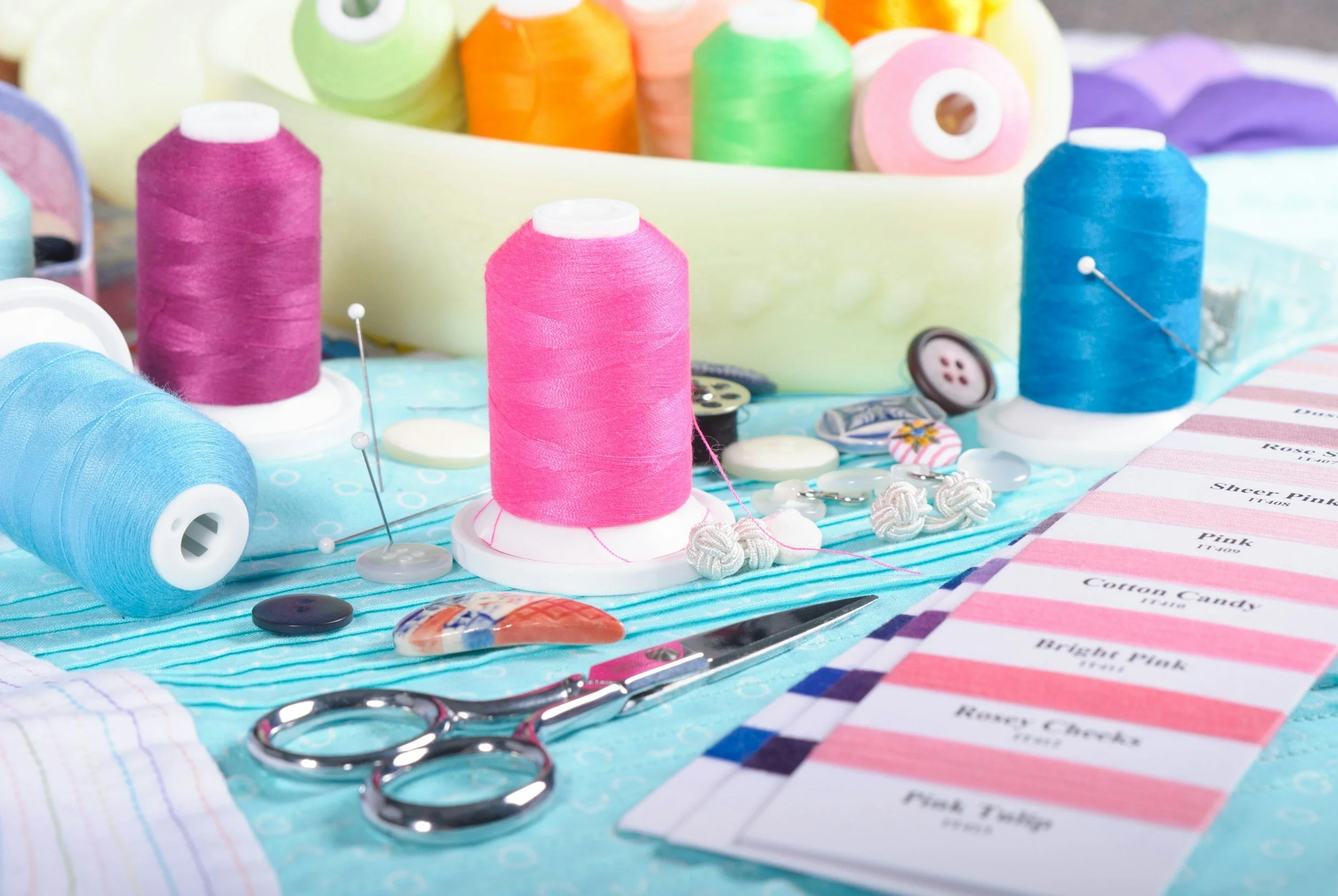 Close up of tailoring tools and thread.