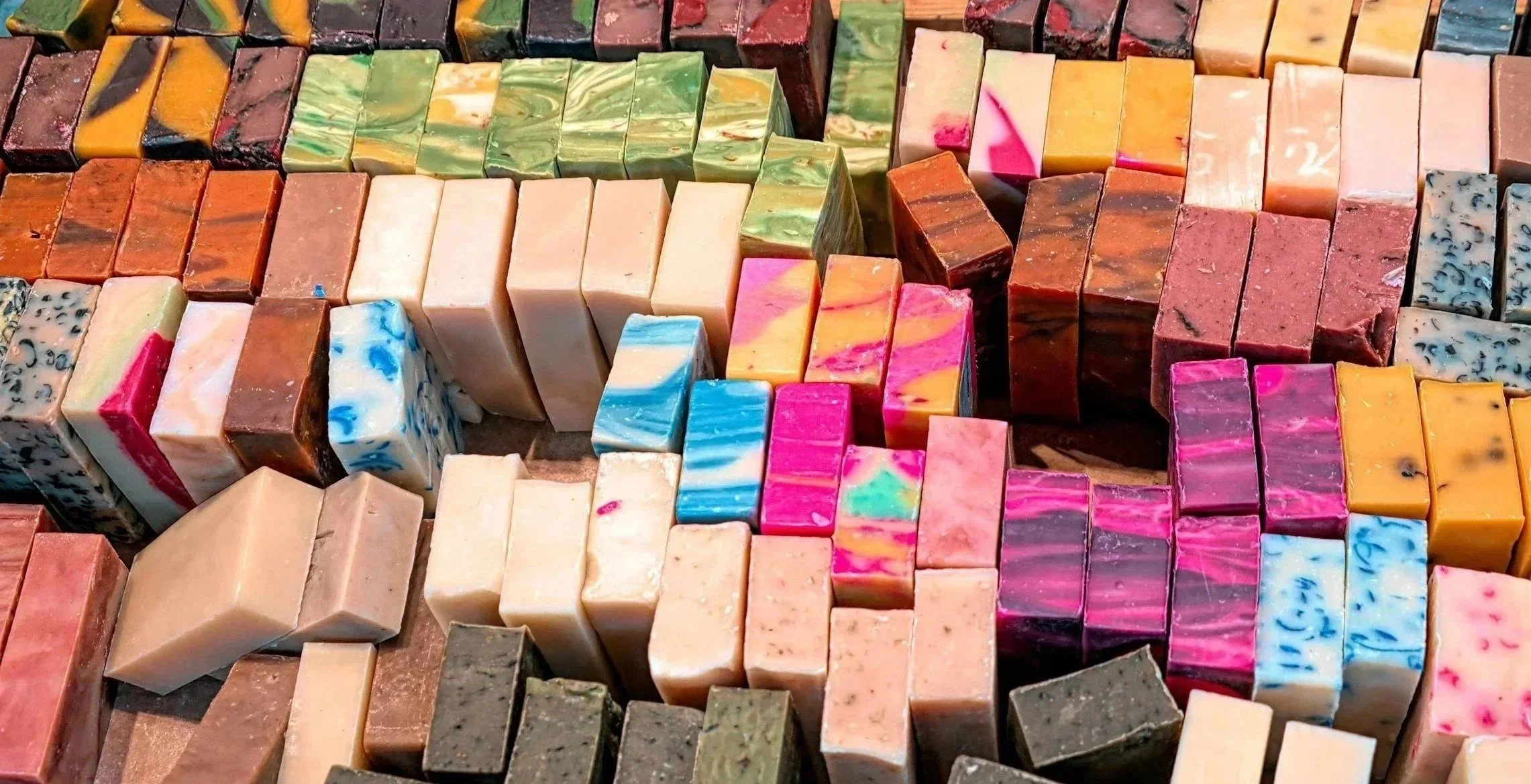 Multiple bars of soap with different patterns and colors.