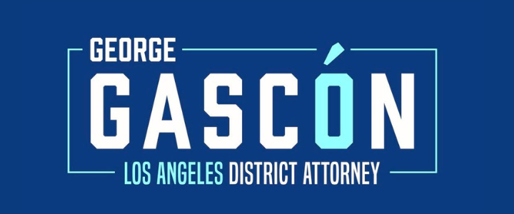 Campaign sign for George Gascón, Los Angeles District Attorney, with name and title displayed against a blue background.